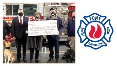 Several people holding oversized check in front of Fire Truck with a dog & logo for FDNY Foundation