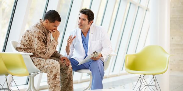 Doctor consulting a military personnel