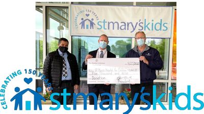 image of 3 people holding oversized check and logo of St. Mary's Kids